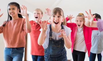 Children acting as lions